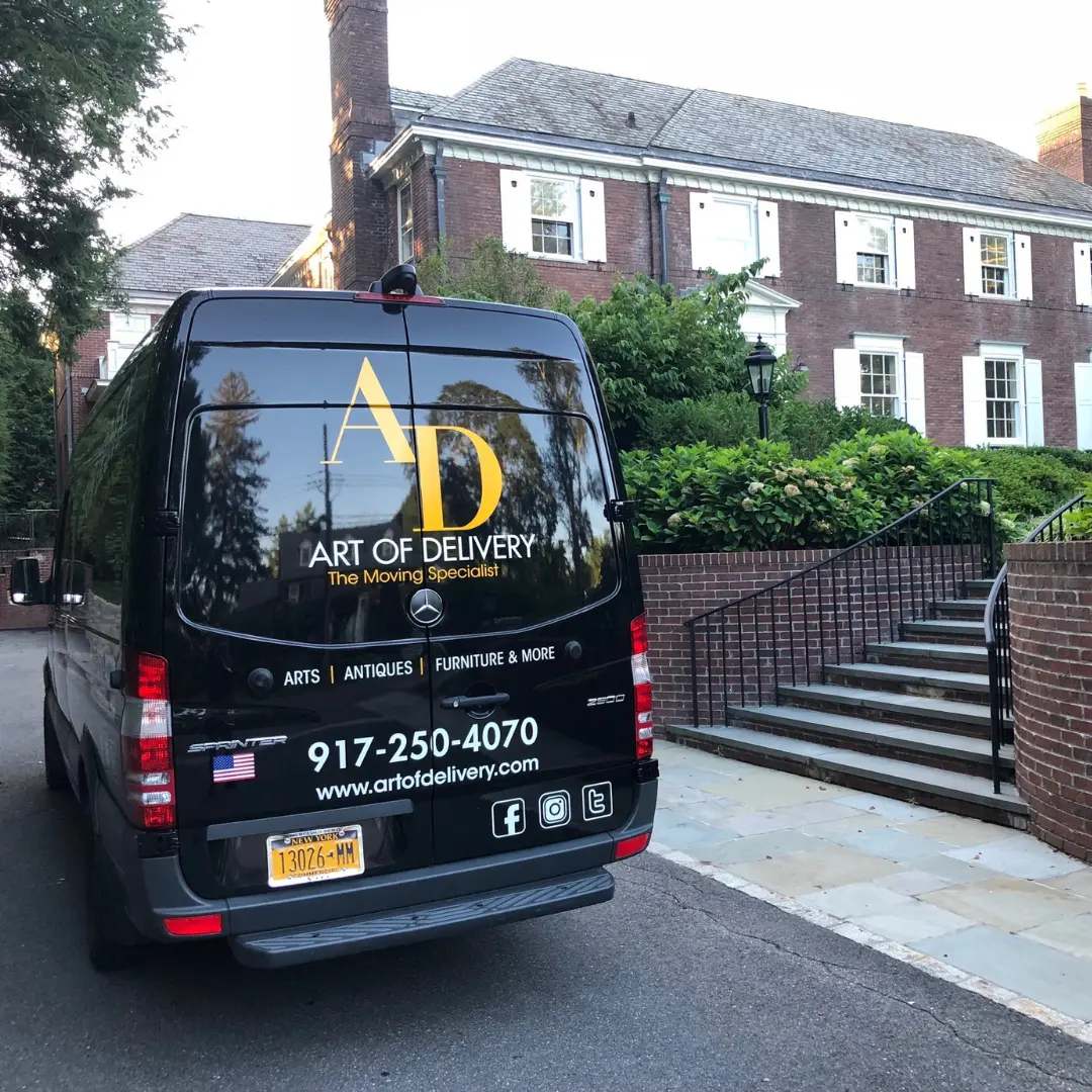 Art of Delivery van parked at a private residence